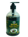 A 500 ml plastic pump bottle with Nidhi Herbal Shampoo.